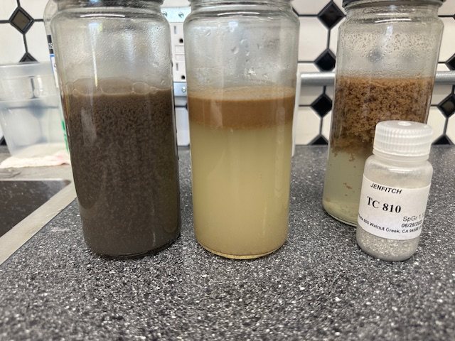 Sludge settling and clarity before and after JC 9465 dosing.